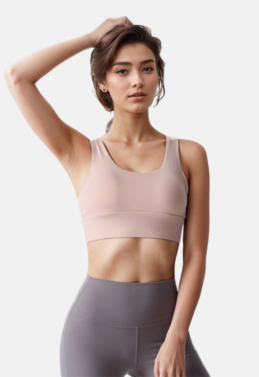 A model in a pink sports bra top from ucharm store and grey leggings, featuring removable padding as a yoga bra.