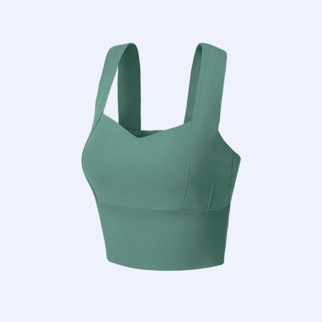 "Sage green plus-size sports bra combining style with functional support"