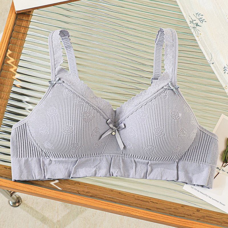 Ash grey close-fitting bra with lace trim that contours and supports.