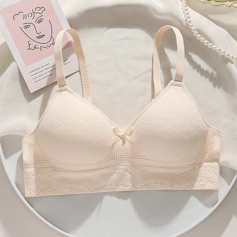 Beige bra with hollow-out breathable cups and high elasticity for extra side support.