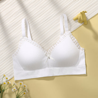 Seamless and airy white bralette, perfect gathering for young girls, accented with gentle lace trim.