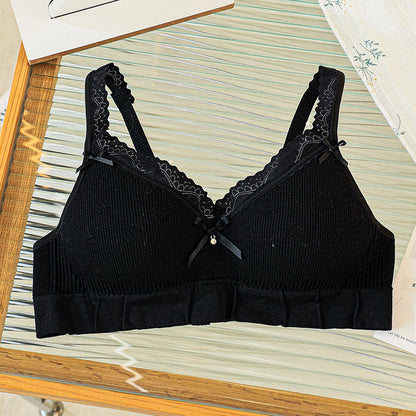 Black close-fitting bra with lace trim, offering comfortable support and stylish design.