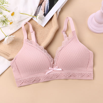 Comfort-focused stretchy bralette featuring breathable fabric, delicate lace accents, and a charming front bow, perfect for a youthful style and daily comfort, showcased amidst a backdrop of daisies for a natural, lifestyle appeal.