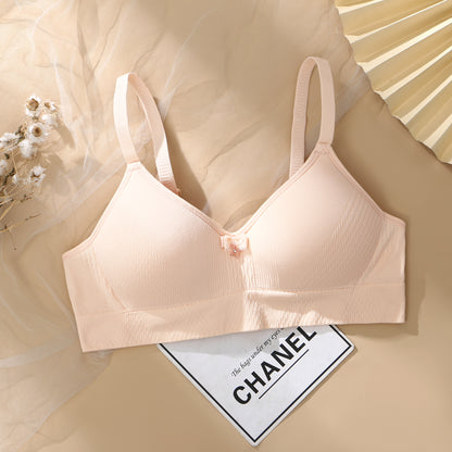 Peach-colored soft-fit bra with three-dimensional cup and breathable comfort, designed for a snug fit.