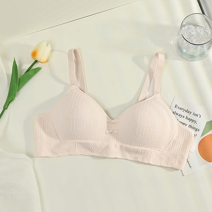 Cream colored wireless bra offering a close chest fit and anti-sagging support, suitable for everyday comfort.