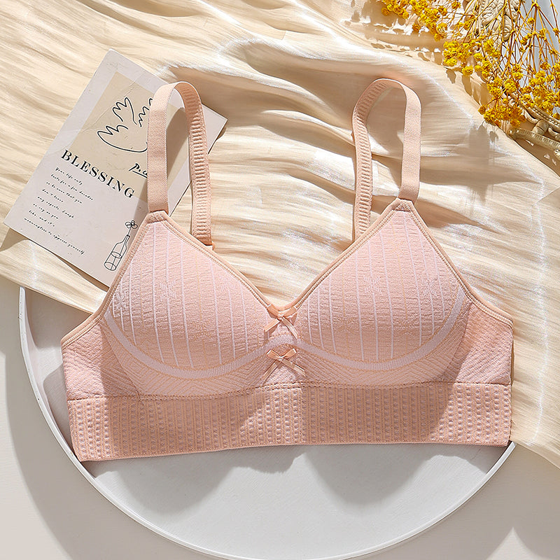 Peach-colored breathable honeycomb bra, wire-free design providing a gentle lift and side bulge control.