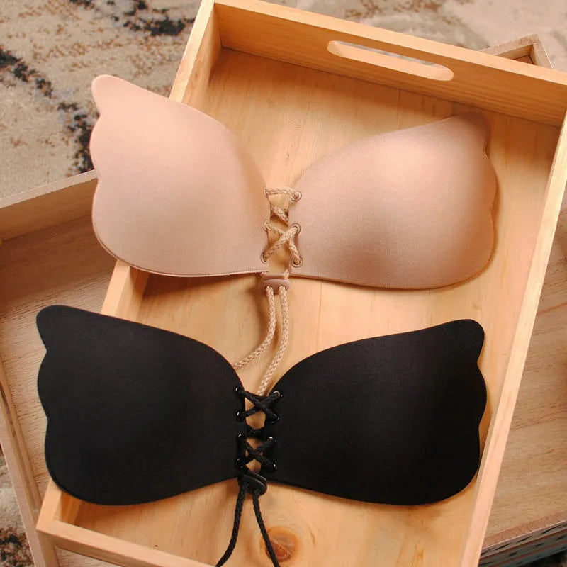 nude and black colored adhesive stick on bra 