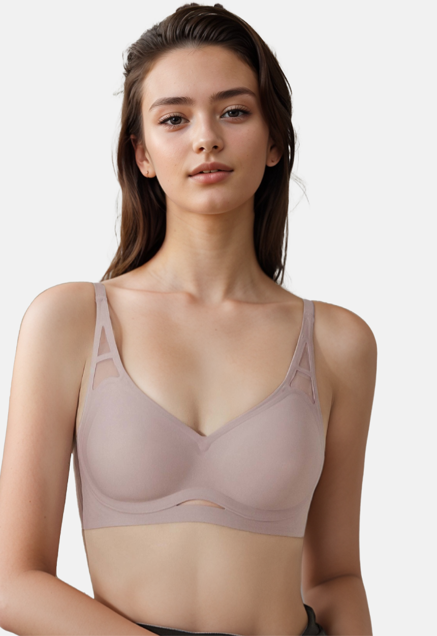 Woman in a light mauve wireless bra with W-shaped support structure and seamless edges made by ucharm bras.