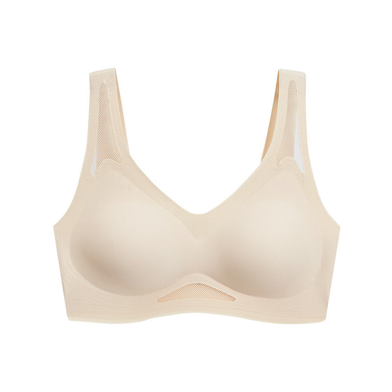 Beige seamless sculpting bra featuring mesh insets for breathability made by ucharm bras