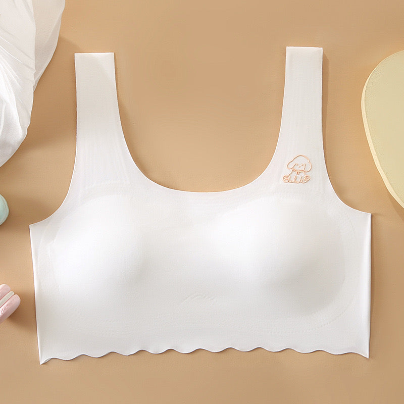 White seamless developmental vest bra with smooth U-back design for young girls