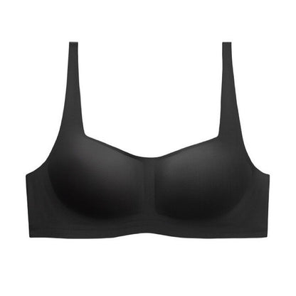 Black wireless half-cup bra with integrated support structure, made from high-stretch fibers, offering a soft touch feel.