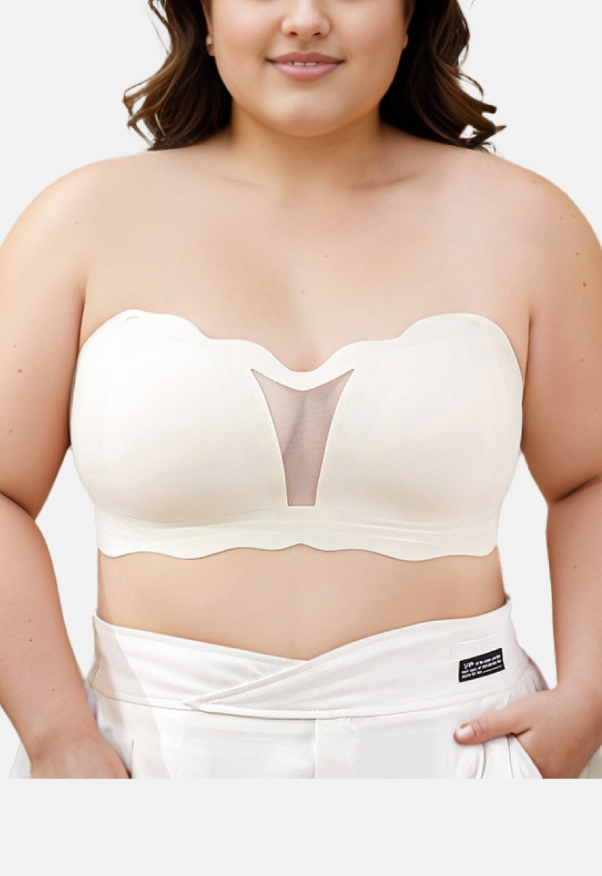 a plus size women wearing a white strapless bandeau bra with a mesh core