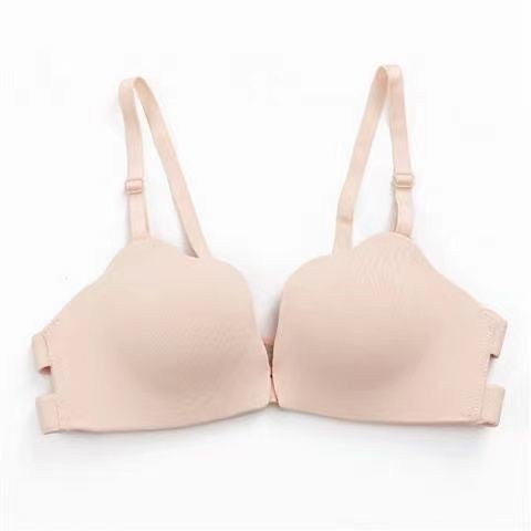 Neutral beige seamless bra with adjustable straps, ideal for daily wear