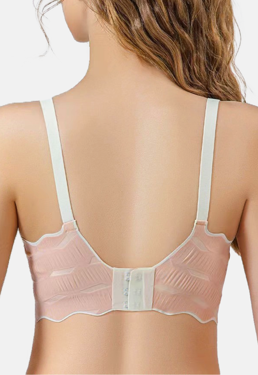 Rear view of a woman wearing a comfortable maternity bra with transparent mesh detailing and convenient front clasp closure