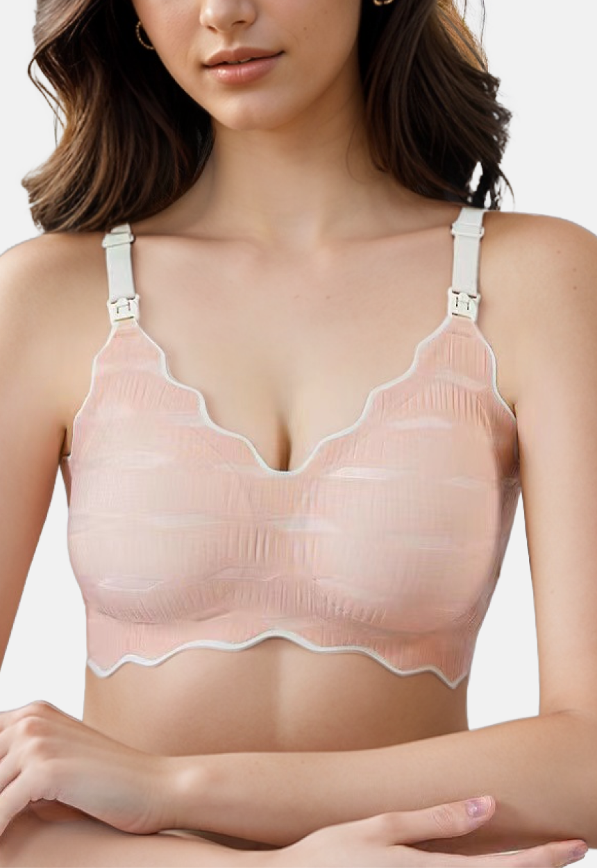 "Model wearing a lightweight peach nursing bra with nursing clasp and wire-free support"