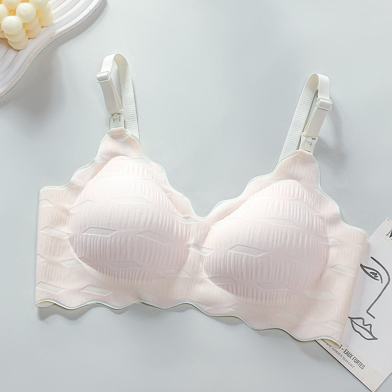 "Pure white, soft nursing bra designed for comfort with practical feeding clasp"