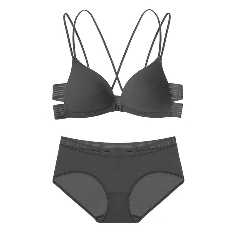 "Classic black front-closure bra set with strappy back detail and thin matching panties"