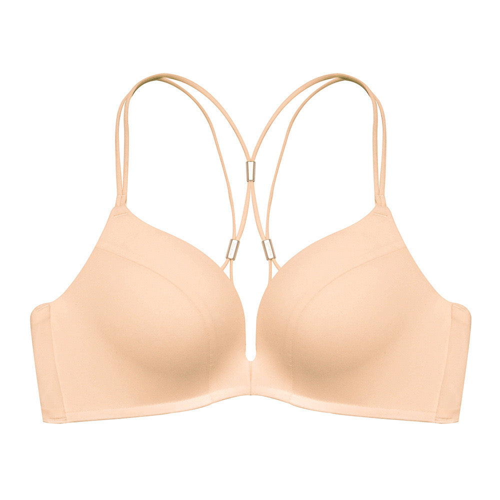 "Nude seamless bra with a front clasp and multi-strap back design, providing both comfort and style"