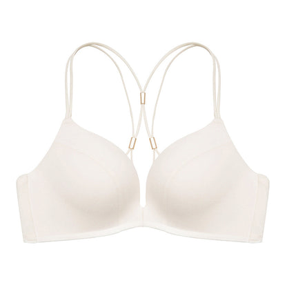 "Cream-colored front-open seamless bra with minimalistic design and decorative back straps"