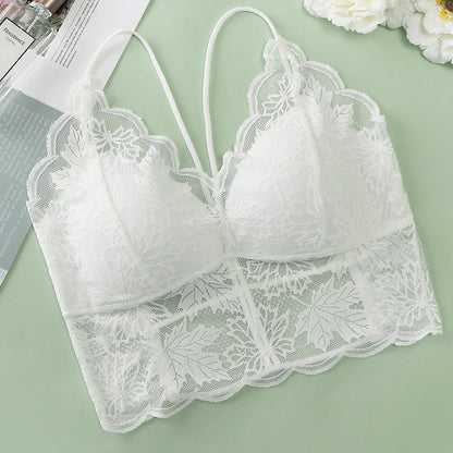 White lace bralette featuring intricate leaf designs and scalloped edges.