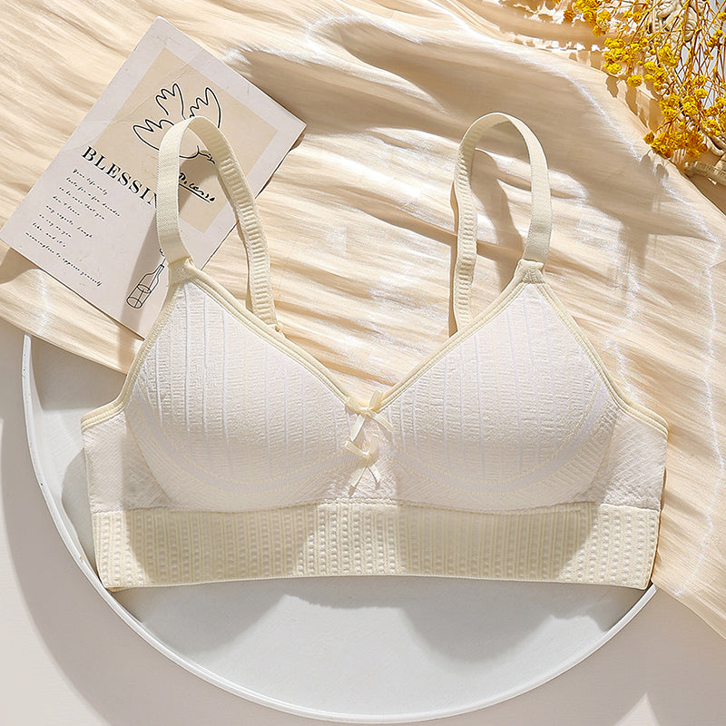 Light cream wire-free bra with honeycomb breathable fabric, offering a lifting effect and side bulge control.