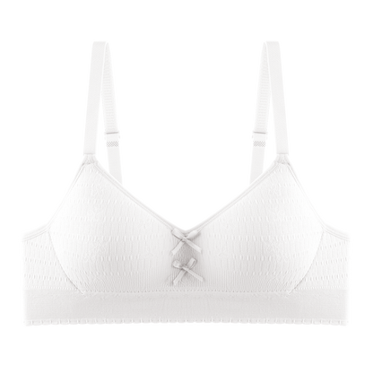 Girl's cream bra with a seamless interior and soft fabric for a comfortable, breathable fit