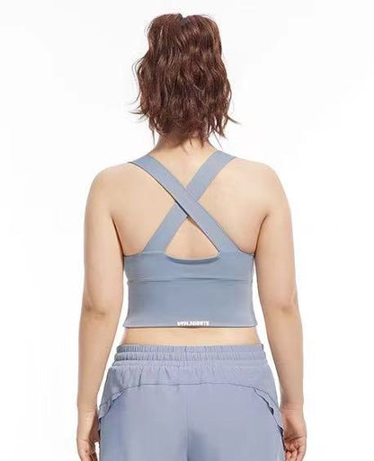 back view of a model in blue cross back yoga sport bra from ucharm sotre