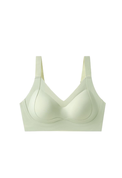 A light green women's sports bra top with strong support, full coverage, broad straps, and designed for plus size women. Made by ucharm bras